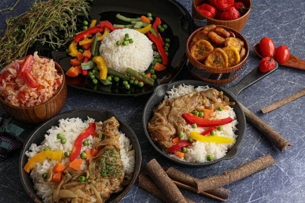 Colourful African dishes with rice, vegetables and stew